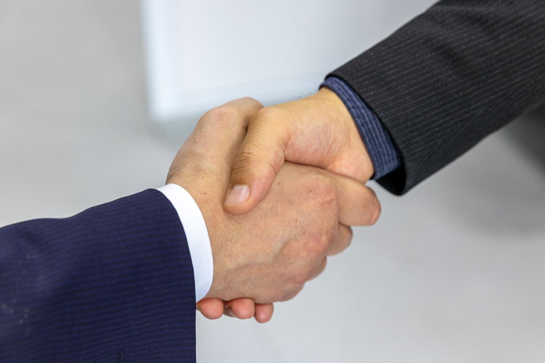 Two hands shaking on the 30-day money-back guarantee