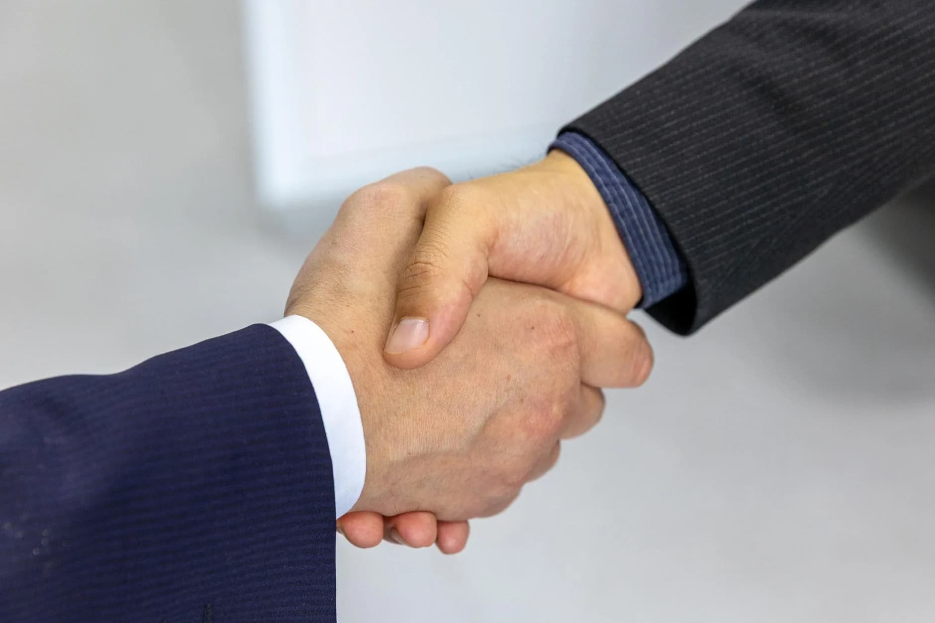 Two hands shaking on the 30-day money-back guarantee