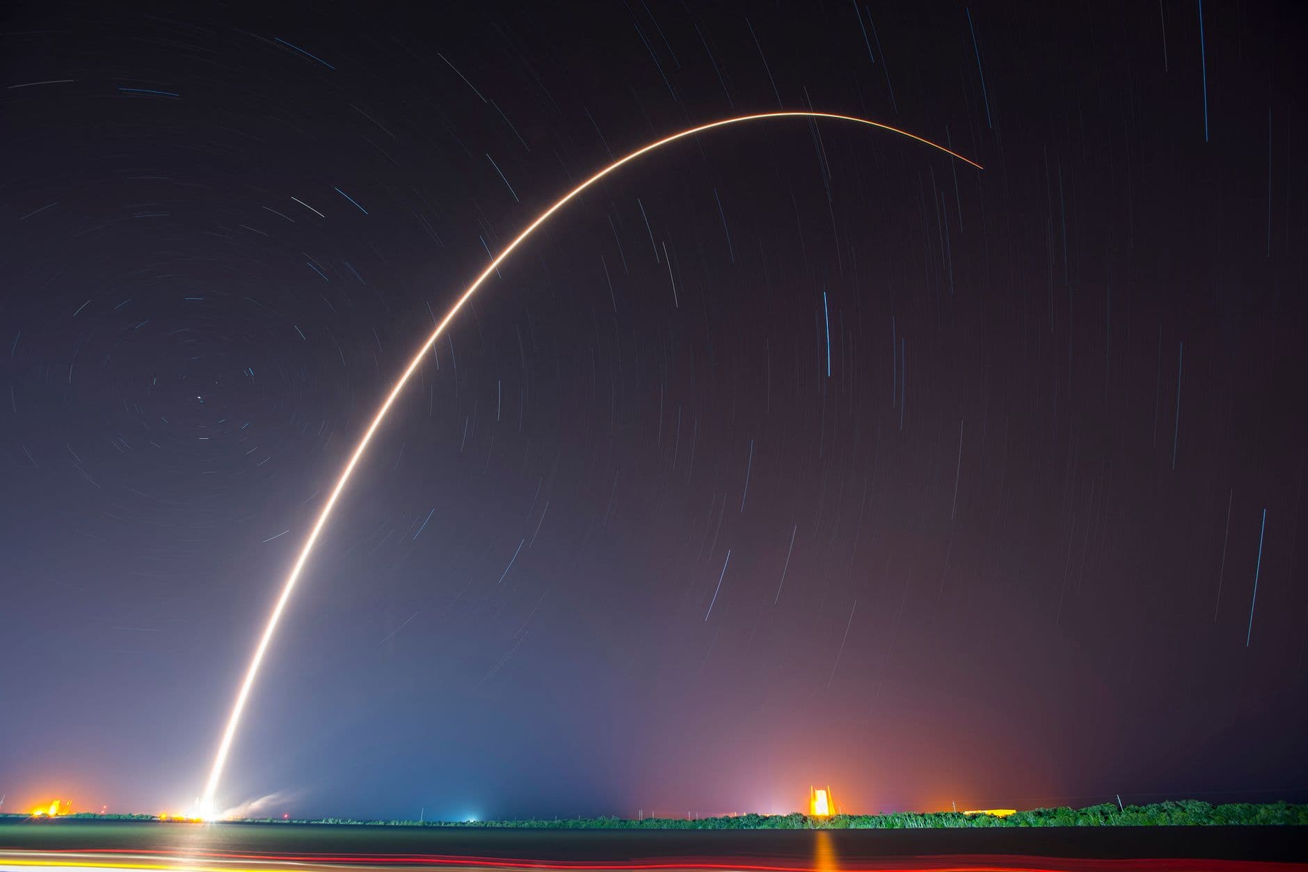 A rocket climbing through a night sky as a website goes live