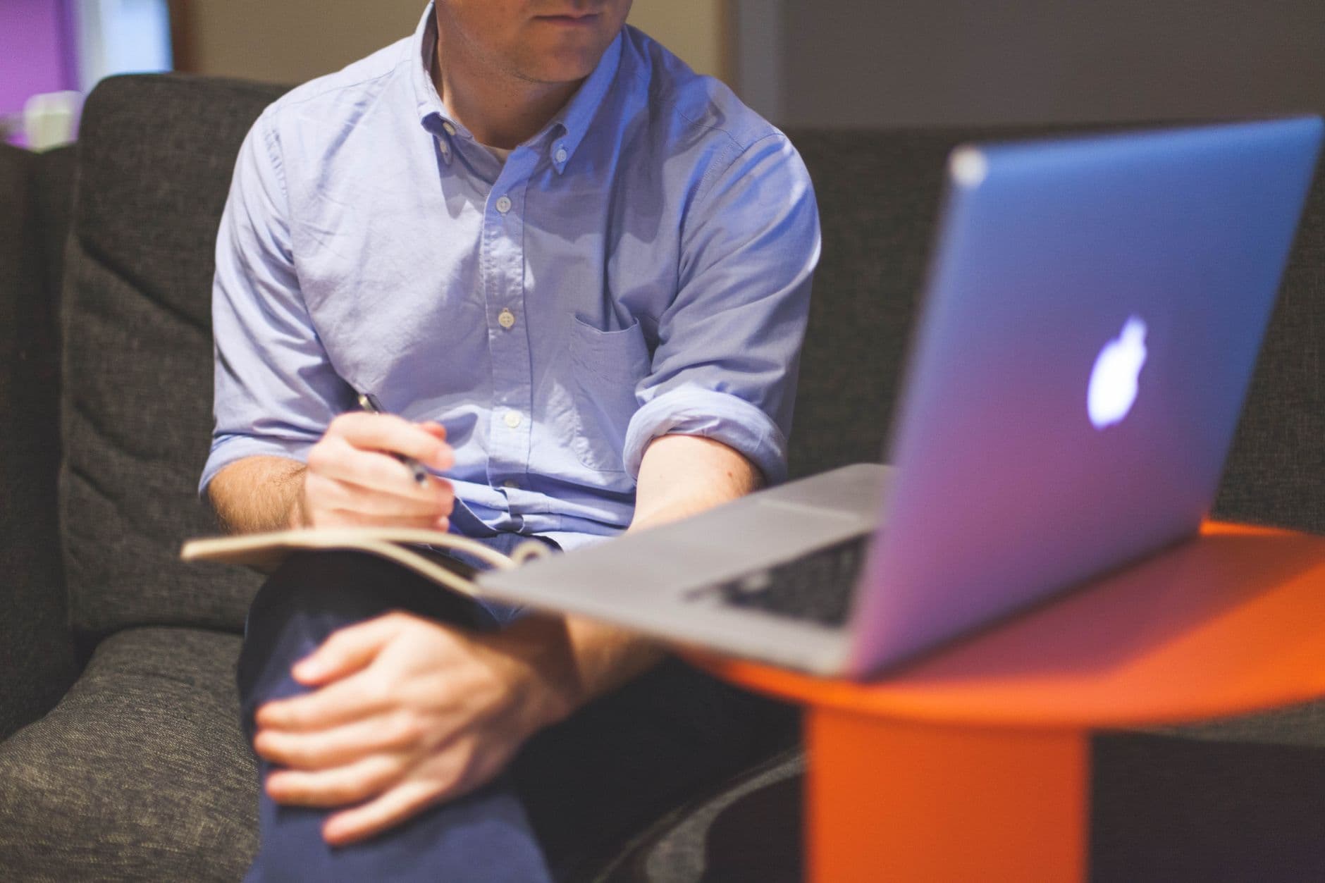 A business owner running a reseller hosting operation from a laptop
