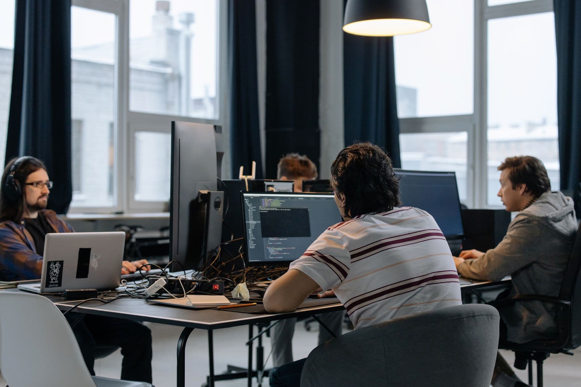A young company working together in a shared workspace